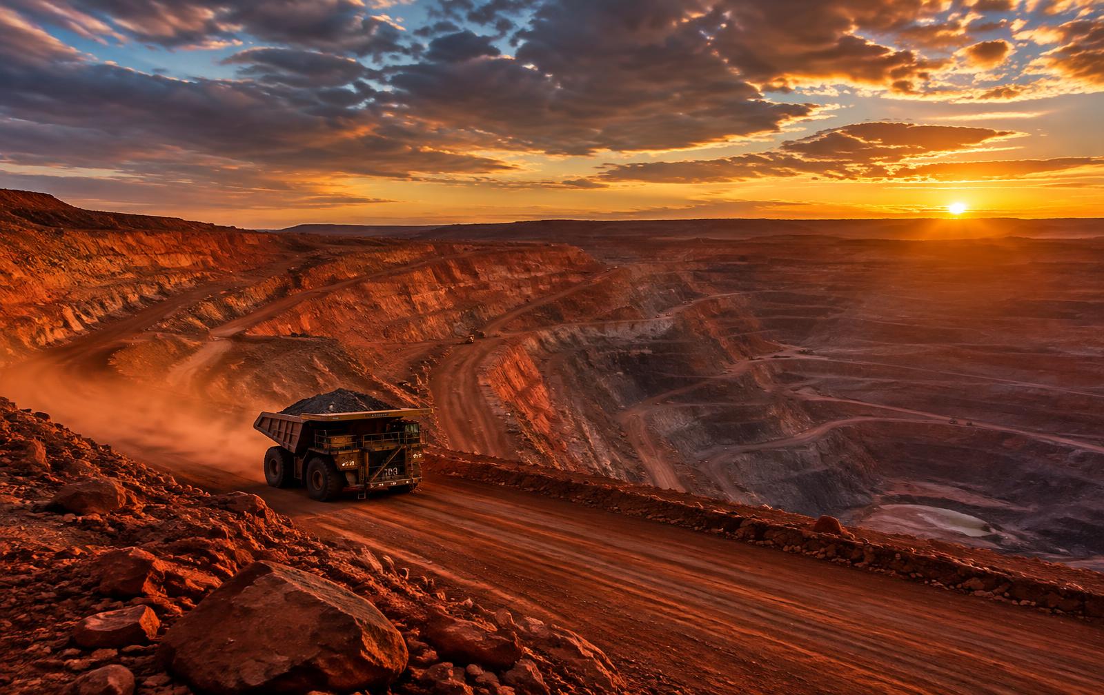 Haul truck on a red-earth mine road near Kathu